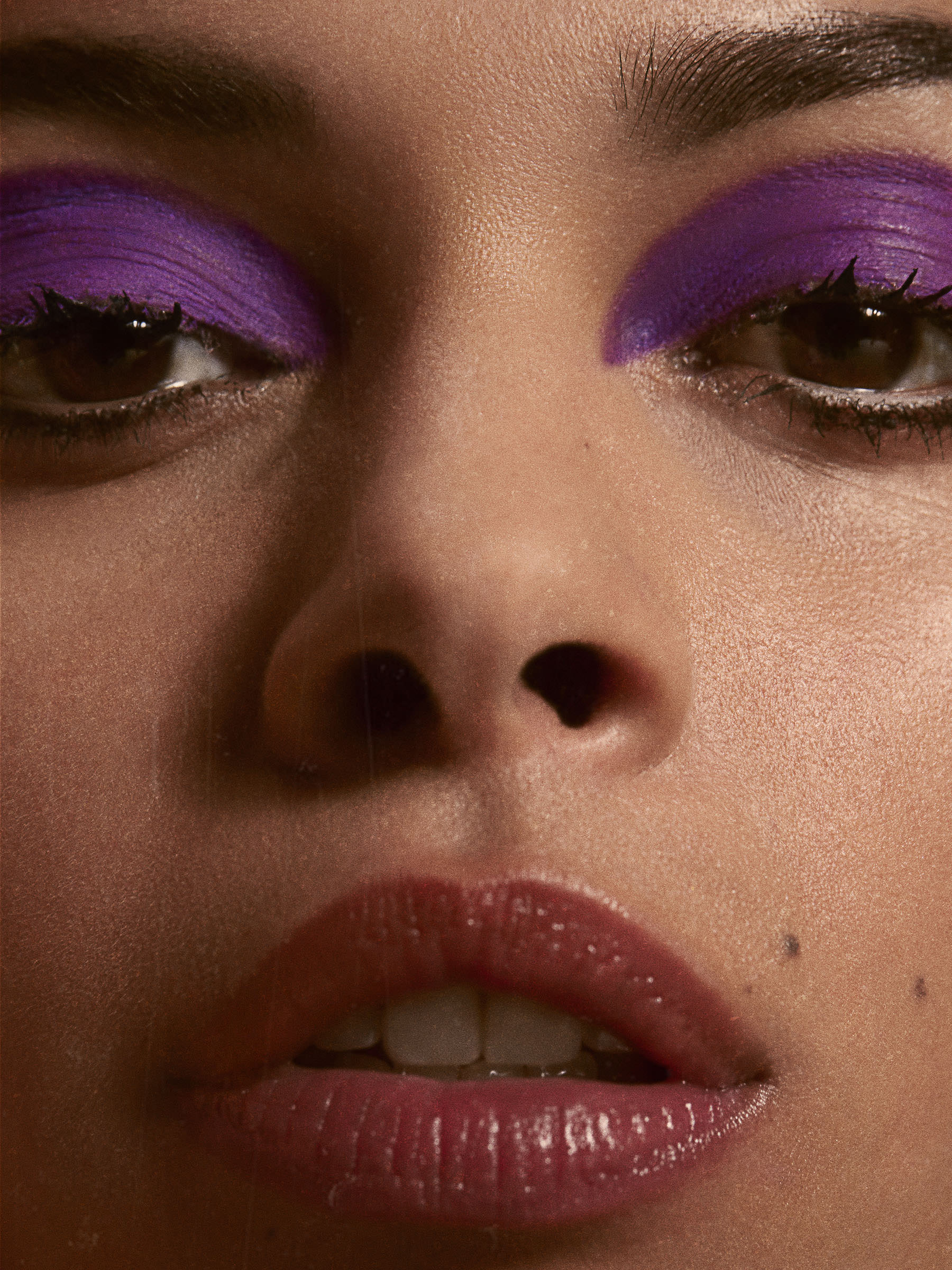 Fashion Makeup close-up of a woman wearing purple eyeshadow